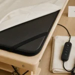 Surmatelas chauffant table de massage : confort thermique et fixation